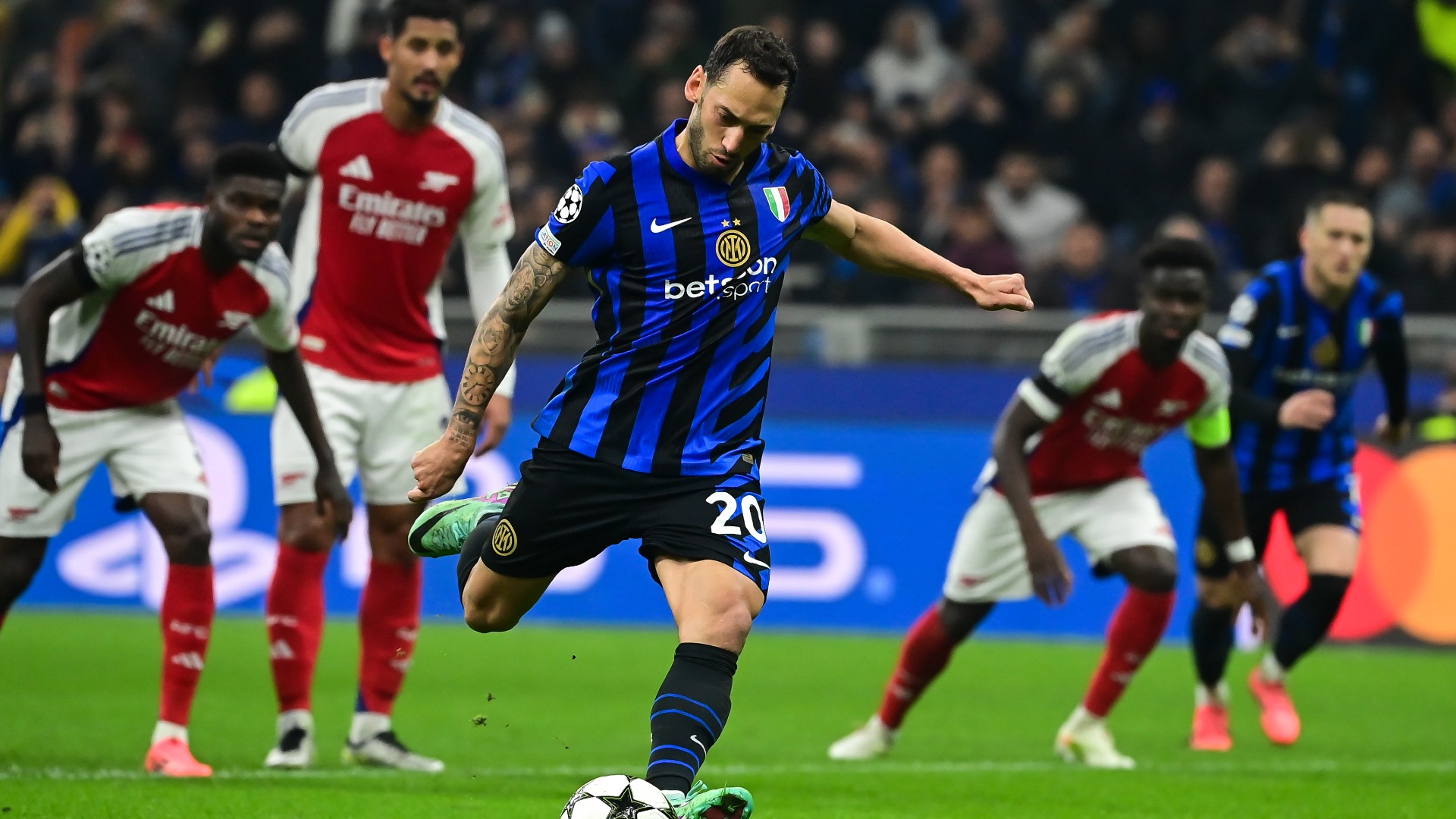 Controversial Penalty Sinks Arsenal in San Siro Struggle